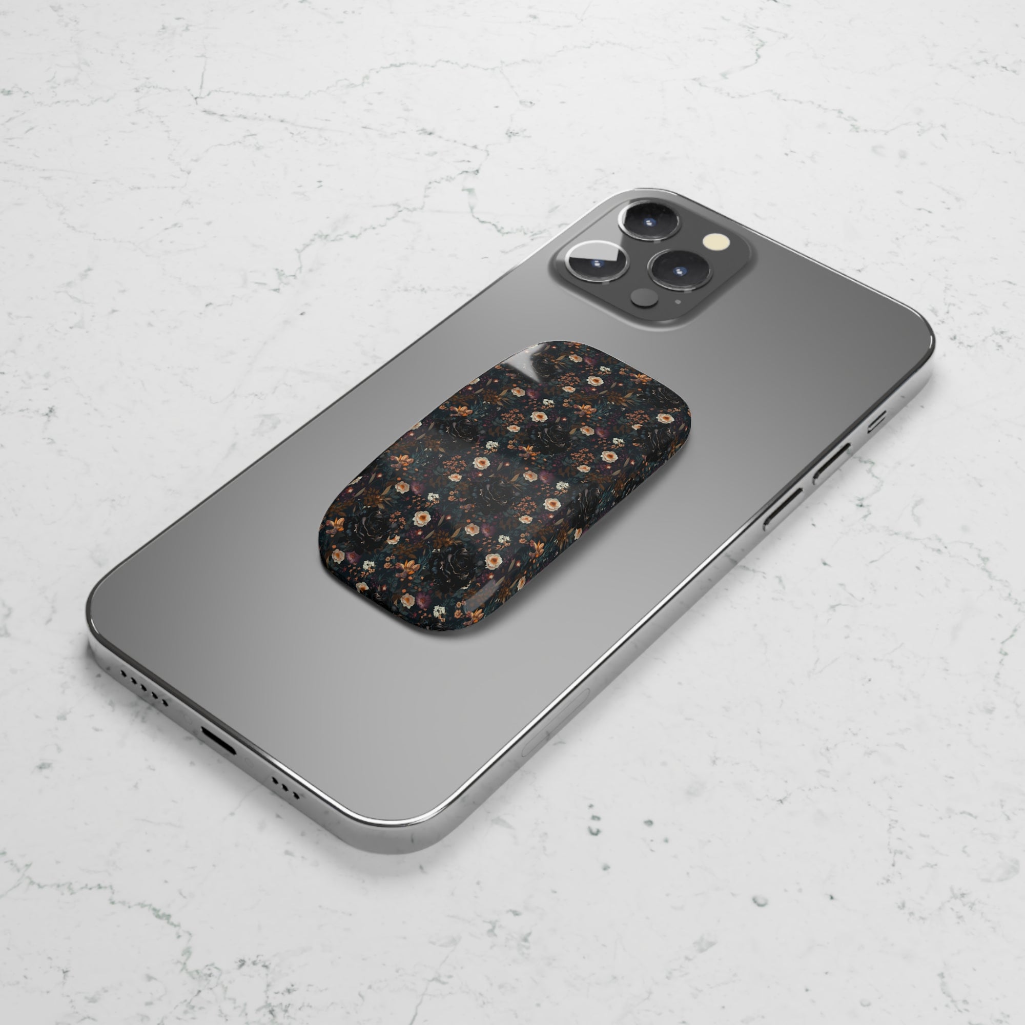 Mysterious Garden Phone Grip featuring dark floral designs giving secure and stylish grip .