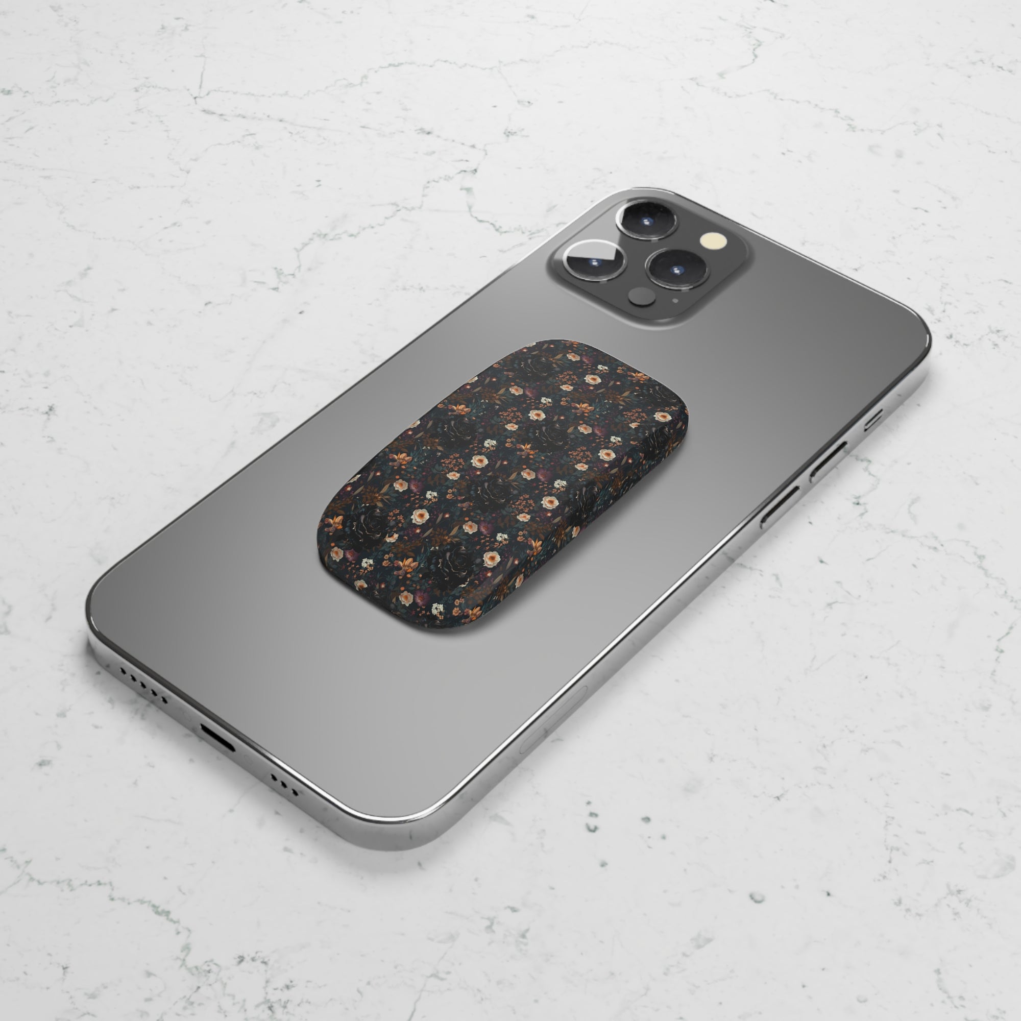 Mysterious Garden Phone Grip featuring dark floral designs giving secure and stylish grip .