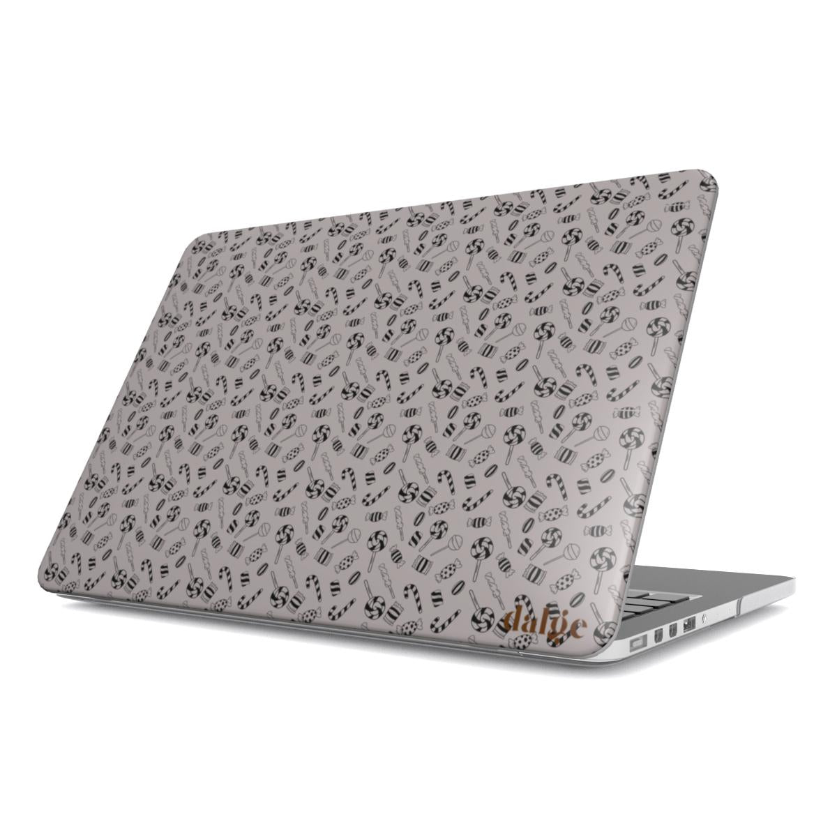 Sticky Pop Laptop Case from our collection welcome to the party featuring designs of small candies in graphic black color in matte finish full covering the MacBook