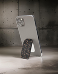 Mysterious Garden Phone Grip featuring dark floral designs giving secure and stylish grip .