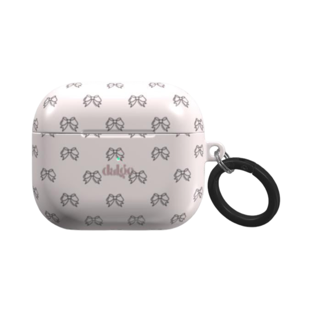 Pretty Bows Earbuds Case featuring black graphic bows on pastel pink glossy background.