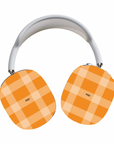 Pumpkin Tart Max Cases featuring orange checkered designs to artistically cover your AirPods Max.