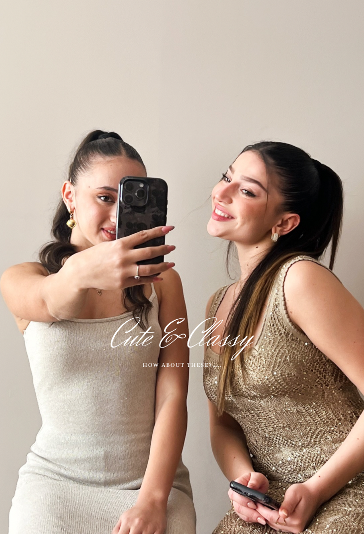 Main banner featuring two girls in beige dresses sitting together, smiling at each other while holding floral-designed phone cases against a natural beige wall." There are buttons with shop now for two different collections.